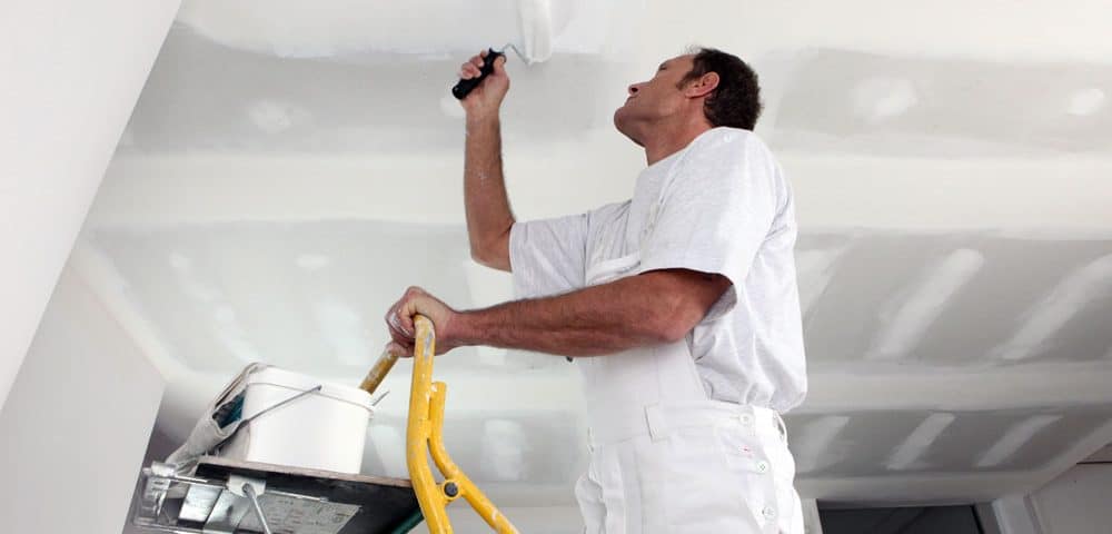 Ceiling painting during a home refurbishment project.